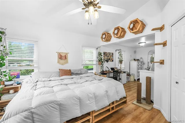 a bed room with a bed and a chandelier