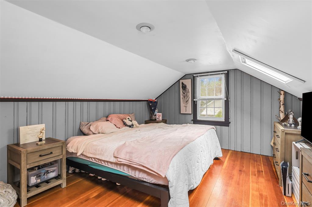 46 Quaker Hill Road Monroe, NY 10950 - Photo 28 of 33 Bedroom featuring light wood finished floors, vaulted ceiling, and a skylight