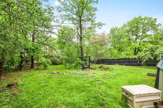 a backyard of a house with lots of green space