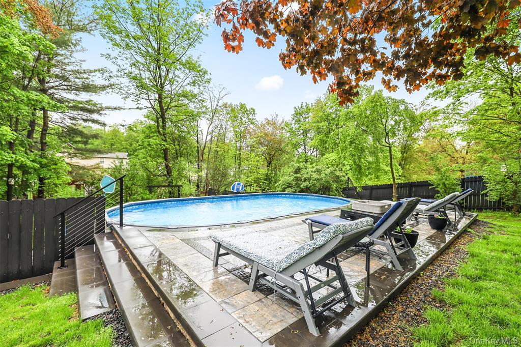 46 Quaker Hill Road Monroe, NY 10950 - Photo 7 of 33 View of pool with a fenced backyard, a patio, and view of scattered trees