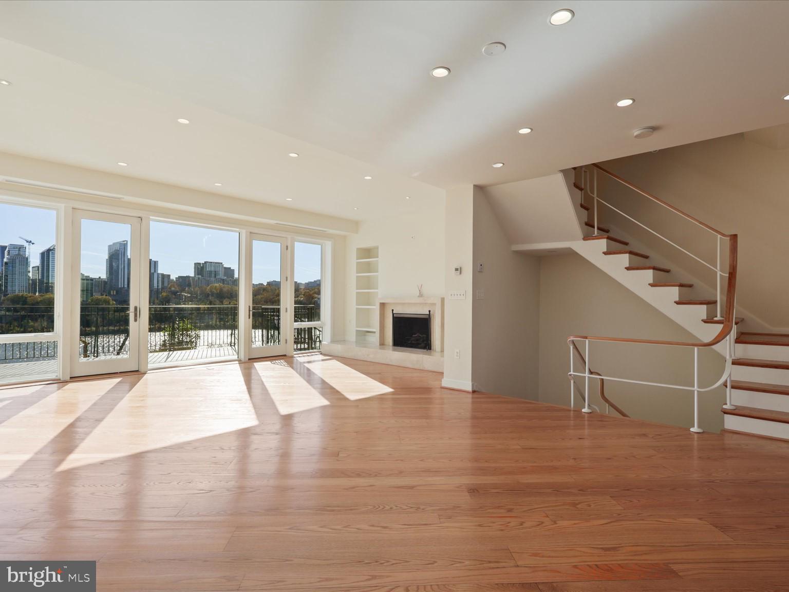 3604 Prospect Street Northwest Washington, DC 20007 - Photo 17 of 70 a view of an empty room with a fireplace and a large window