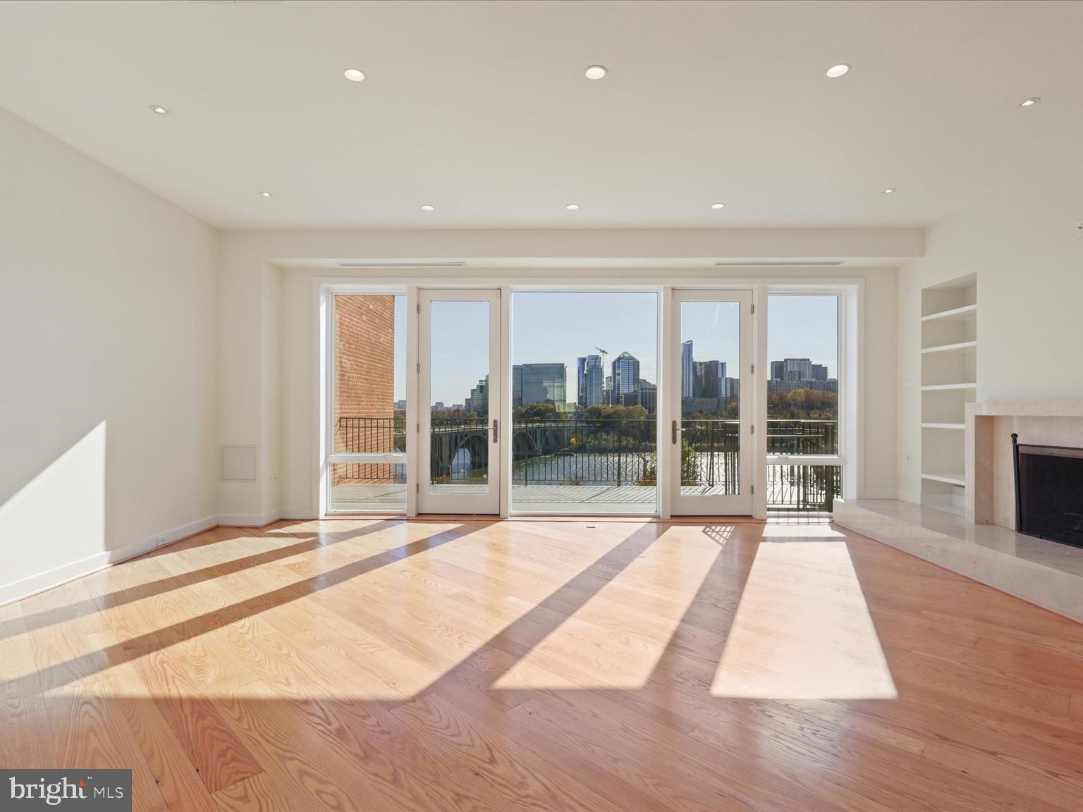 3604 Prospect Street Northwest Washington, DC 20007 - Photo 18 of 70 a view of an empty room with wooden floor and a window