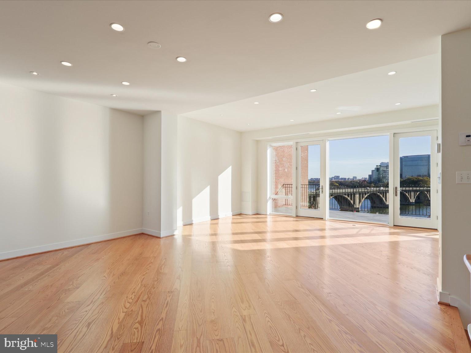 3604 Prospect Street Northwest Washington, DC 20007 - Photo 25 of 70 a view of an empty room with wooden floor and a window
