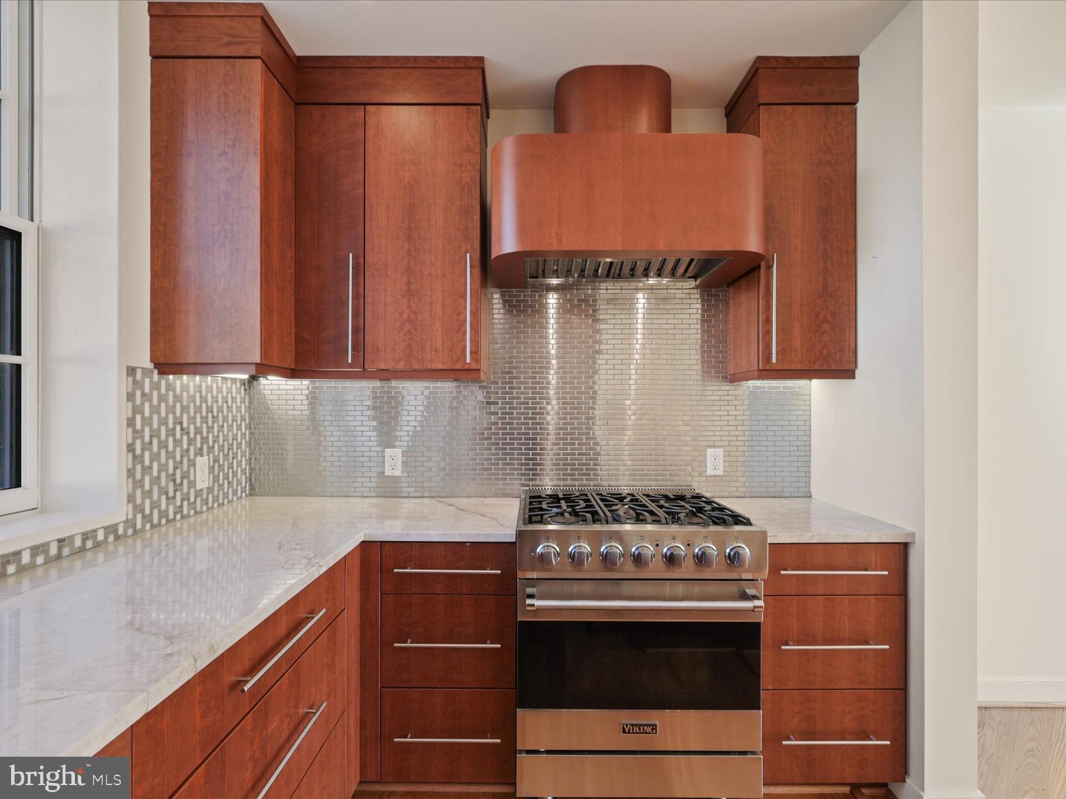 3604 Prospect Street Northwest Washington, DC 20007 - Photo 29 of 70 a kitchen with stainless steel appliances granite countertop a stove and a sink