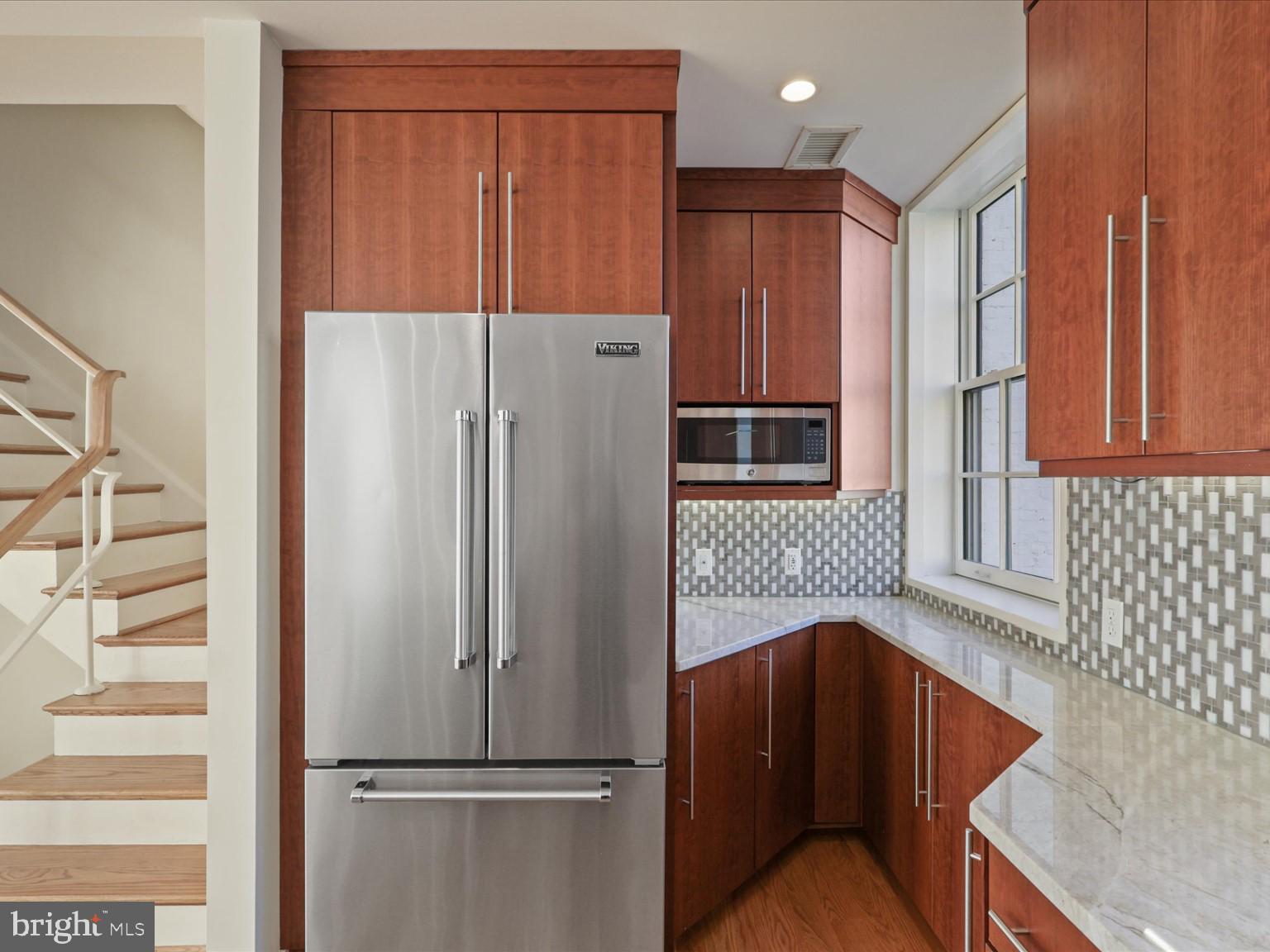 3604 Prospect Street Northwest Washington, DC 20007 - Photo 31 of 70 a kitchen with stainless steel appliances granite countertop a refrigerator and a sink