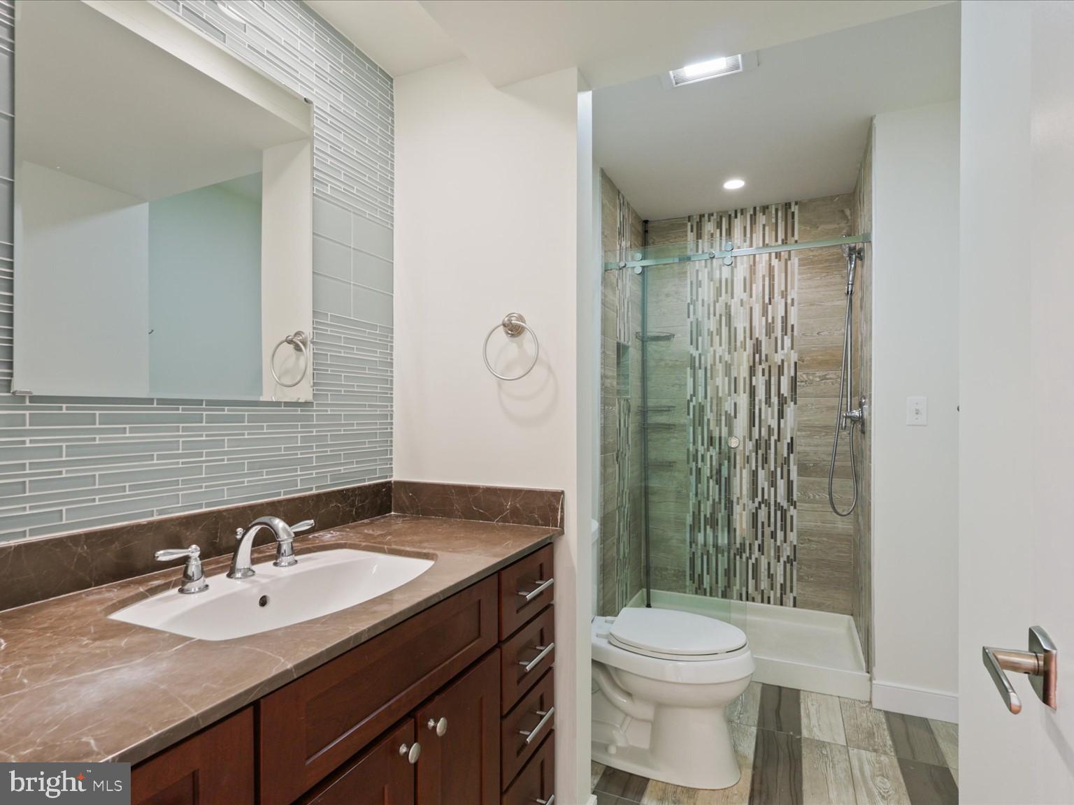 3604 Prospect Street Northwest Washington, DC 20007 - Photo 44 of 70 a bathroom with a sink toilet and shower