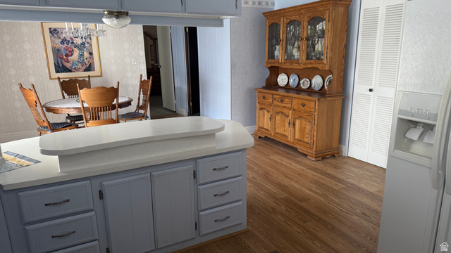 77 West Alta View Way Sandy, UT 84070 - Photo 4 of 43 Kitchen island with light blue cabinetry and light-toned countertops