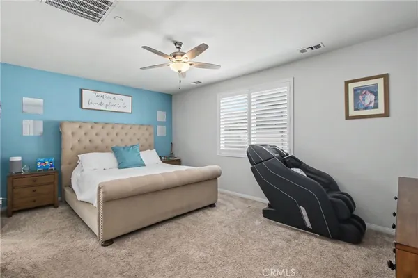 a bedroom with bed and window