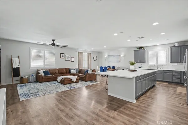 a large white kitchen with a large window