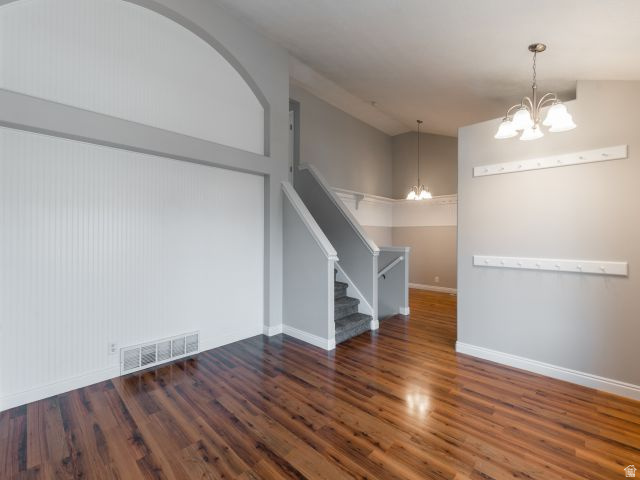 1446 West 1450 North Layton, UT 84041 - Photo 6 of 16 Wood-finish flooring throughout, featuring a staircase with carpeted treads and white risers