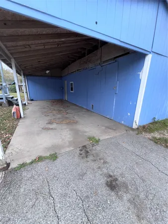 a view of a room with wooden walls