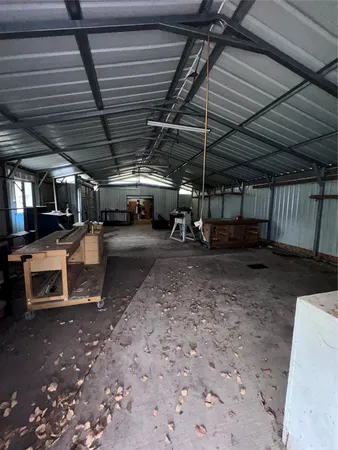 a view of a garage room with parked car