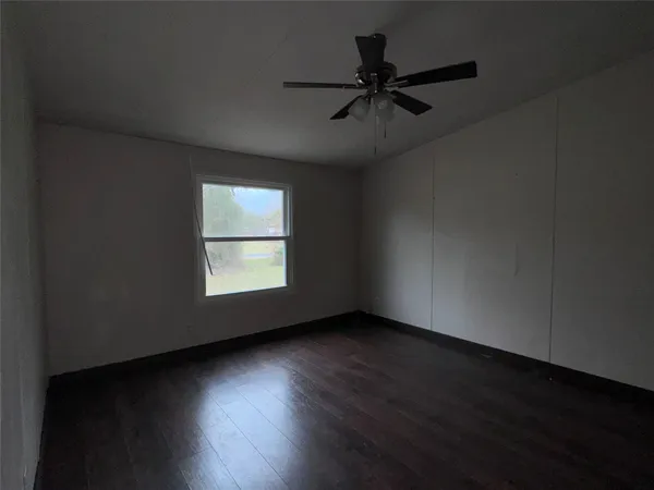 a view of room window and wooden floor