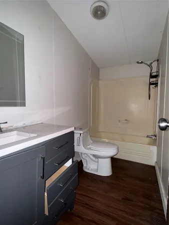 a bathroom with a sink a toilet and a tub