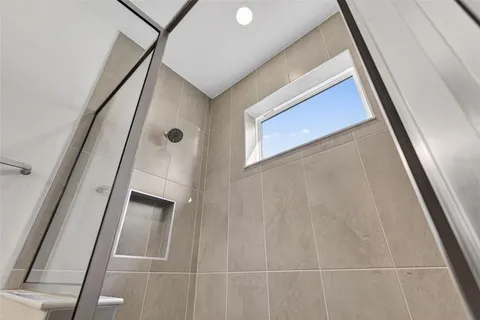 a bathroom with a double vanity sink and mirror