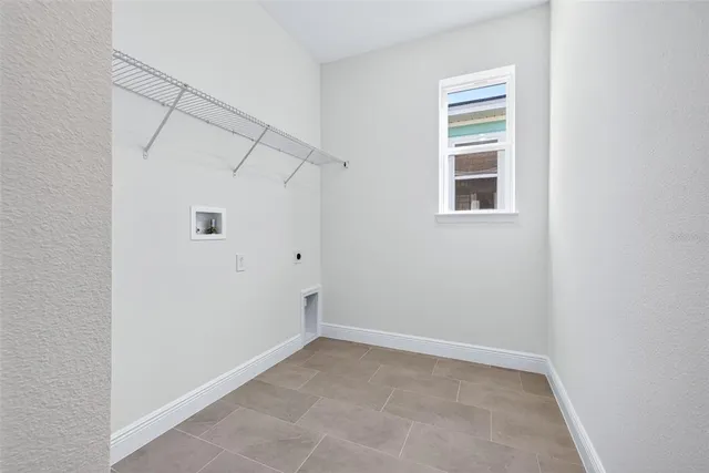 a view of a garage with racks on the wall