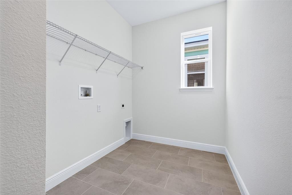 983 Fiesta Key Circle Lady Lake, FL 32159 - Photo 26 of 39 a view of an empty room with a window