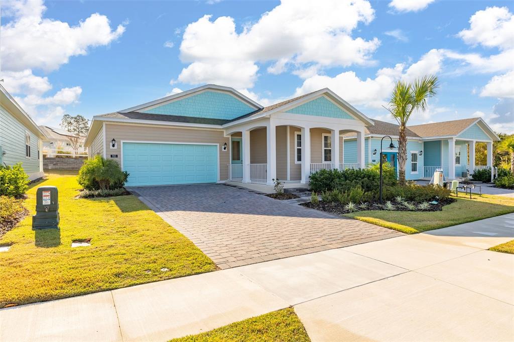 983 Fiesta Key Circle Lady Lake, FL 32159 - Photo 28 of 39 a front view of a house with swimming pool
