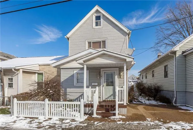 a front view of a house with a porch