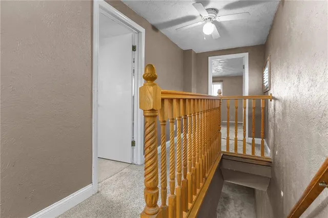 a view of entryway with a front door and wooden floor