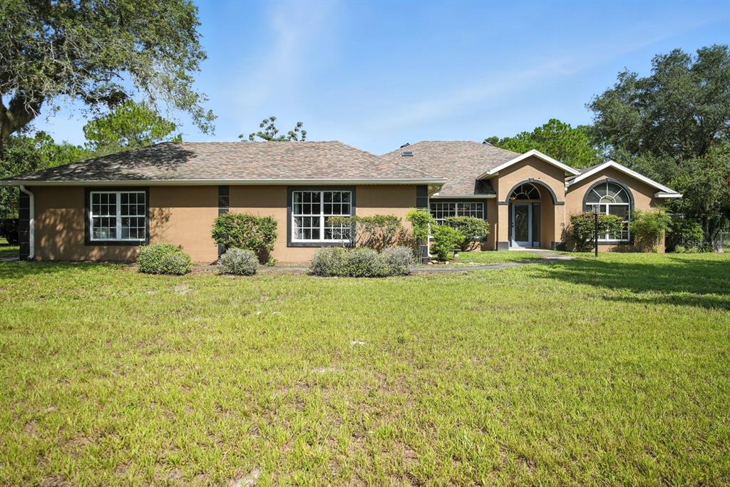 front view of a house with a yard