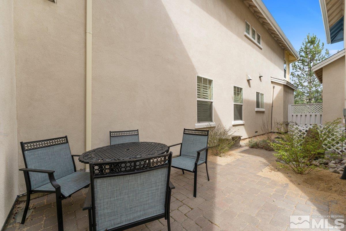 3240 Paragon Place Reno, NV 89509 - Photo 16 of 17 a view of a patio with chair and table