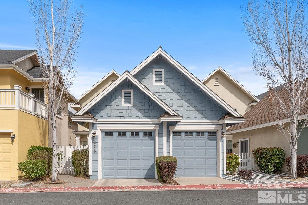3240 Paragon Place Reno, NV 89509 - Photo 3 of 17 a front view of a house with garage
