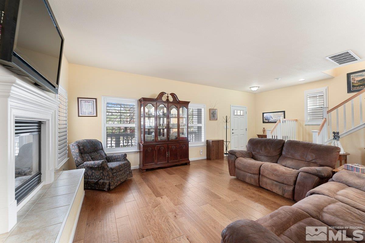 3240 Paragon Place Reno, NV 89509 - Photo 6 of 17 a living room with furniture or couch and a flat screen tv