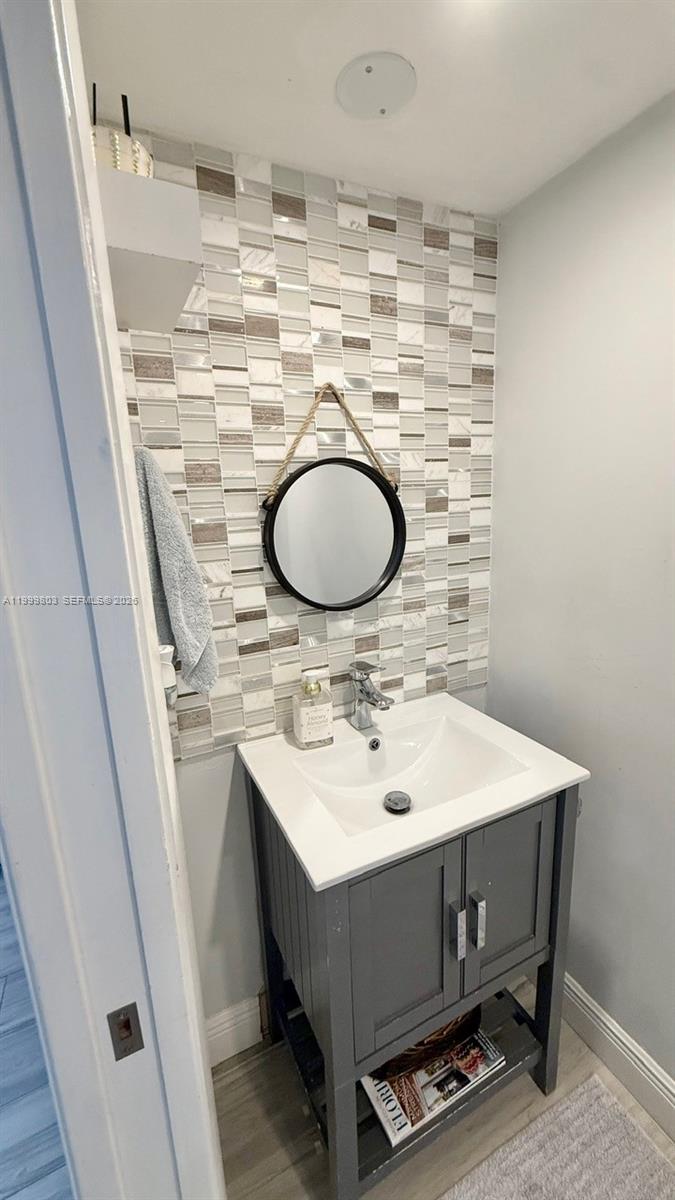 6728 Boca Pines Trail, Unit B Boca Raton, FL 33433 - Photo 12 of 30 a bathroom with a sink and a mirror