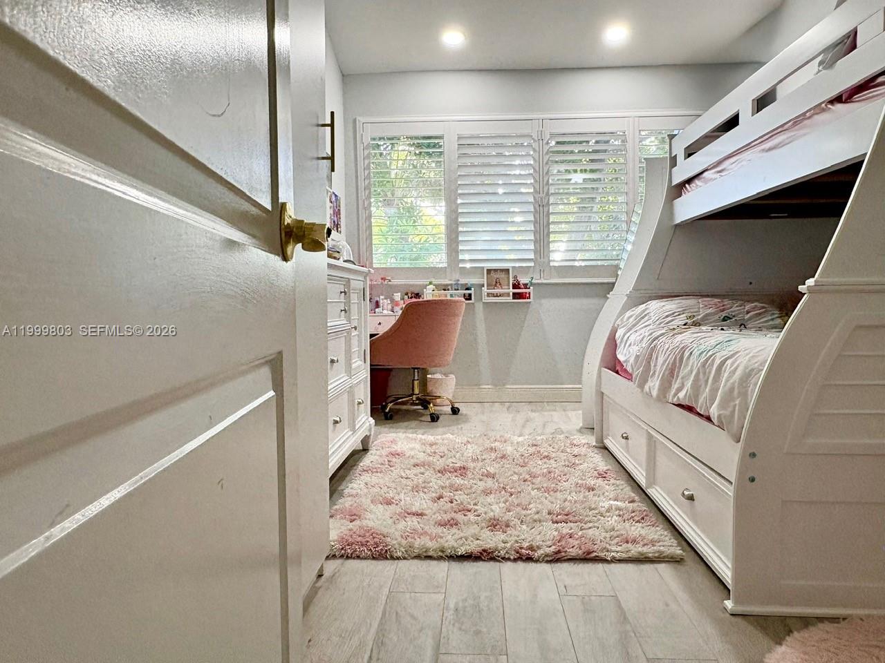 6728 Boca Pines Trail, Unit B Boca Raton, FL 33433 - Photo 17 of 30 a room with a bed and a large window