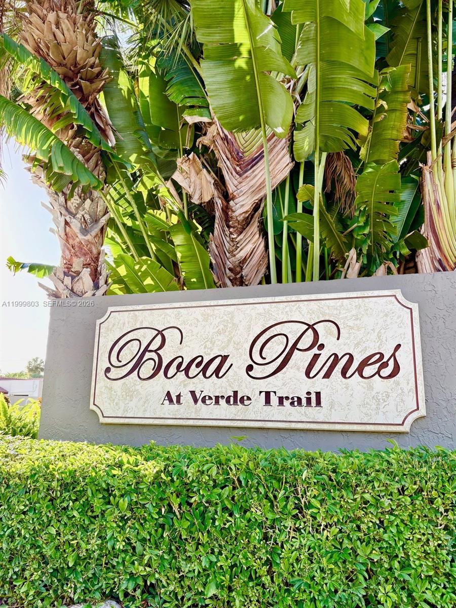 6728 Boca Pines Trail, Unit B Boca Raton, FL 33433 - Photo 2 of 30 a sign that is on a wooden wall