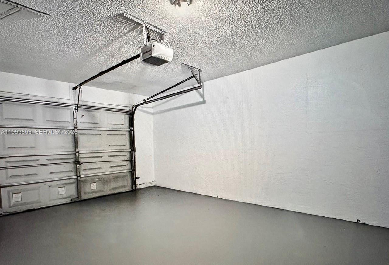 6728 Boca Pines Trail, Unit B Boca Raton, FL 33433 - Photo 27 of 30 a view of a room with an empty space