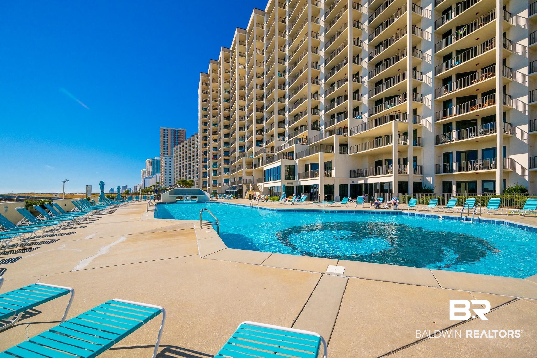 26802 Perdido Beach Boulevard, Unit 406 Orange Beach, AL 36561 - Photo 30 of 37 Community pool with a patio
