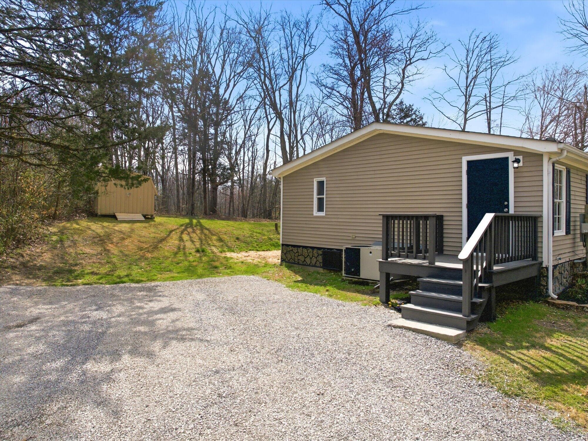 64 County Road 100 Decatur, TN 37322 - Photo 24 of 43 a view of a house with backyard and a tree