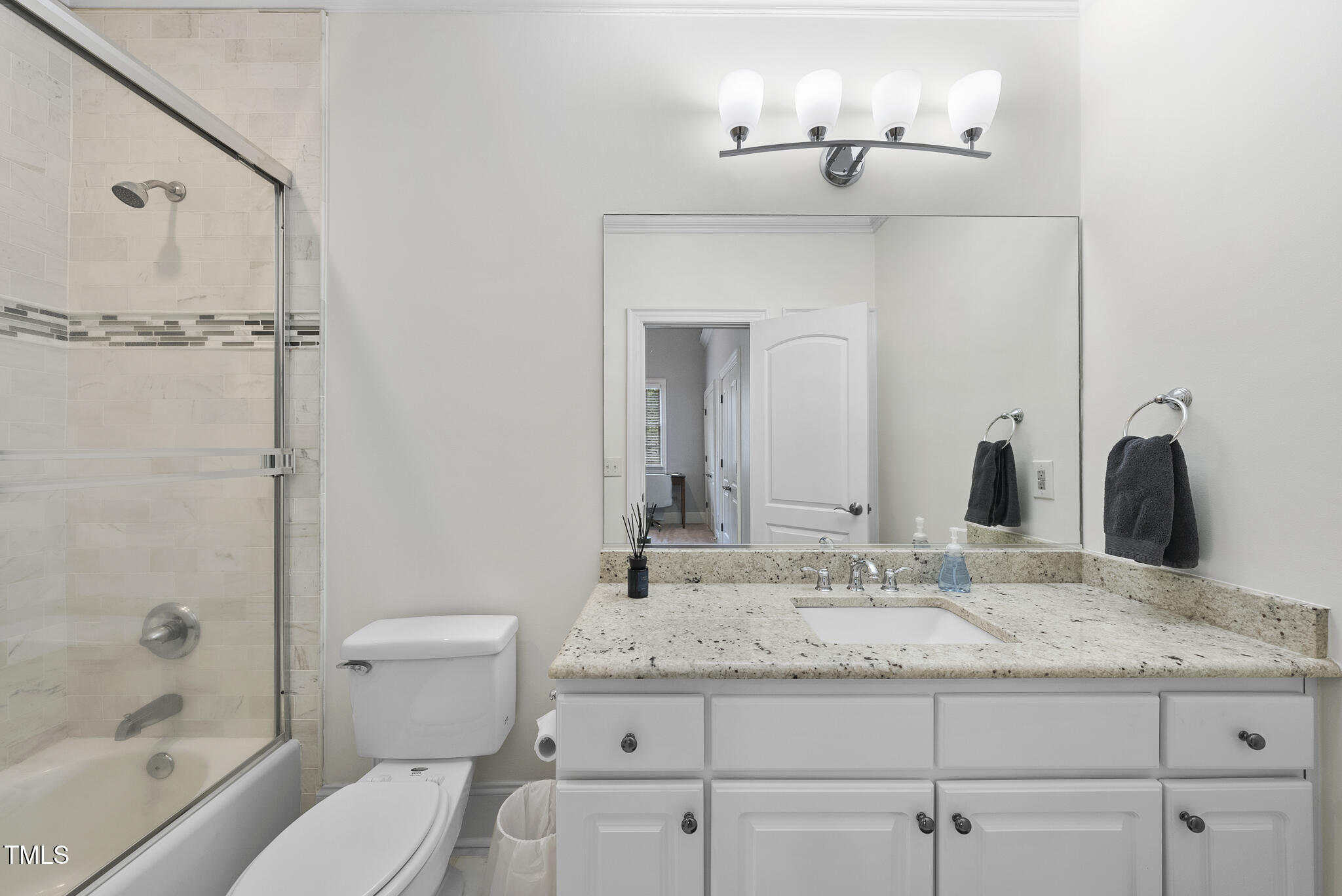 1105 Longstone Way Raleigh, NC 27614 - Photo 24 of 70 a bathroom with a granite countertop sink a toilet and shower