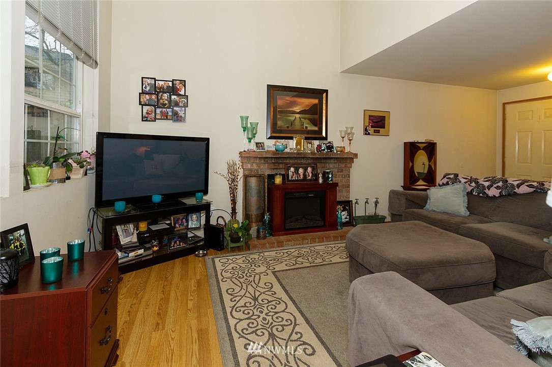 531 Duchess Road Bothell, WA 98012 - Photo 14 of 25 a living room with furniture and a flat screen tv