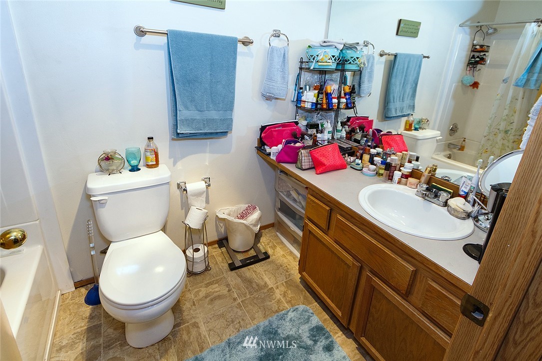 531 Duchess Road Bothell, WA 98012 - Photo 22 of 25 a bathroom with a sink toilet and a mirror