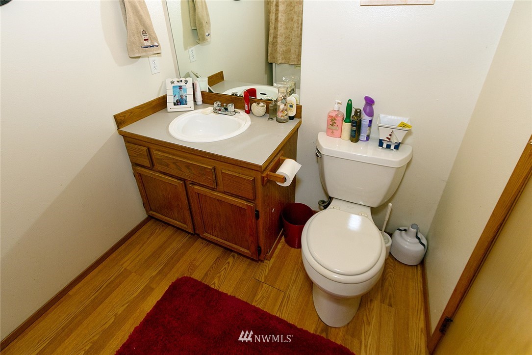 531 Duchess Road Bothell, WA 98012 - Photo 23 of 25 a bathroom with a sink and a toilet