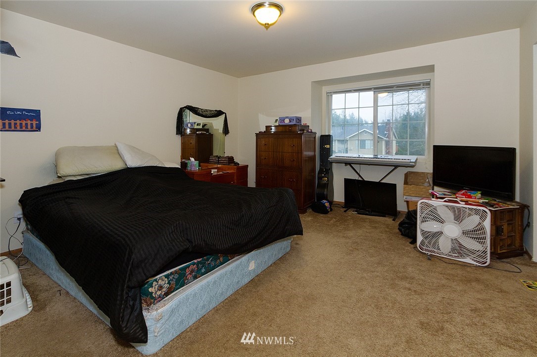 531 Duchess Road Bothell, WA 98012 - Photo 6 of 25 a living room with furniture and a flat screen tv