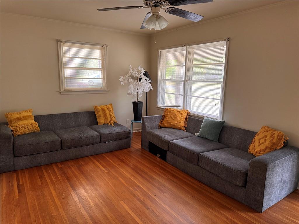 814 Avondale Road Montgomery, AL 36109 - Photo 2 of 10 Living room featuring wood-type flooring, a ceiling fan, and crown molding