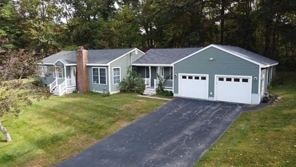 3 McLain Drive Pelham, NH 03076 - Photo 1 of 34 a house with huge green field in front of it