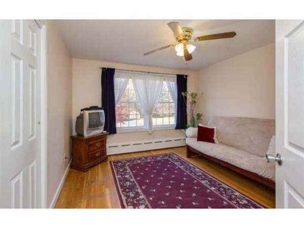 3 McLain Drive Pelham, NH 03076 - Photo 16 of 34 a living room with furniture and a rug
