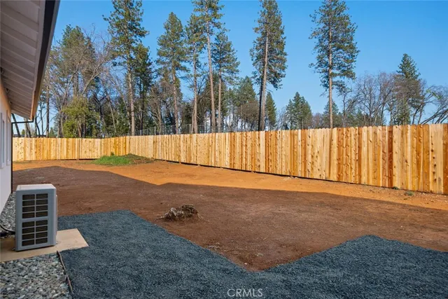 a view of backyard and tree