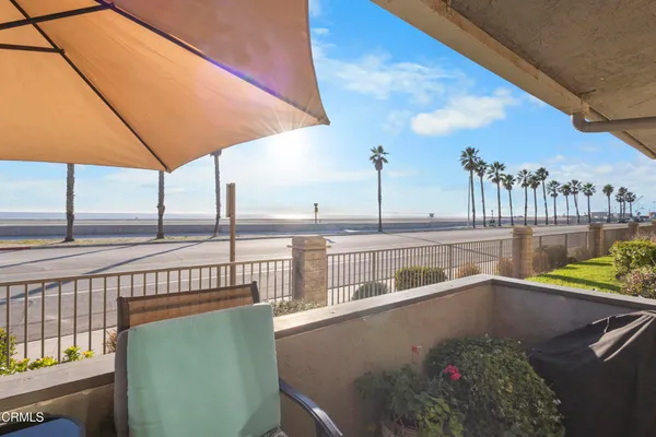 a view of a balcony with chairs