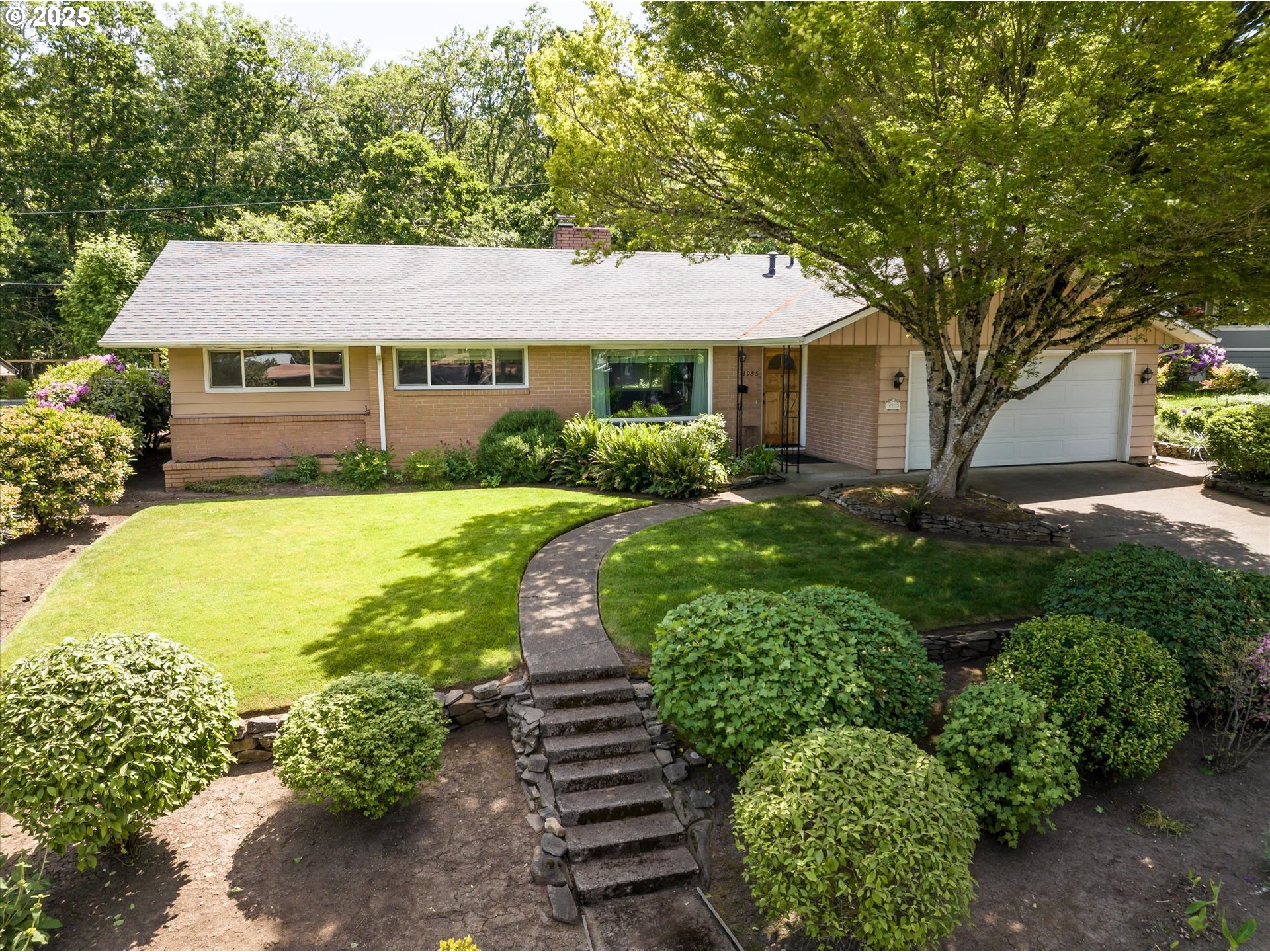 a front view of a house with garden