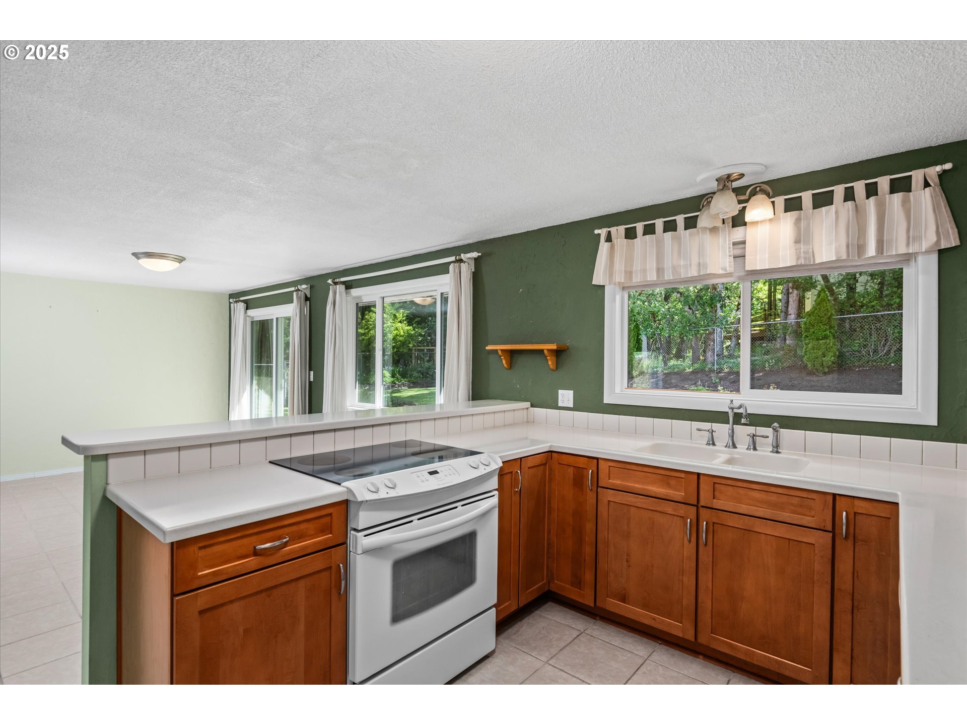 3985 Donald Street Eugene, OR 97405 - Photo 16 of 39 a kitchen with a sink stove and microwave