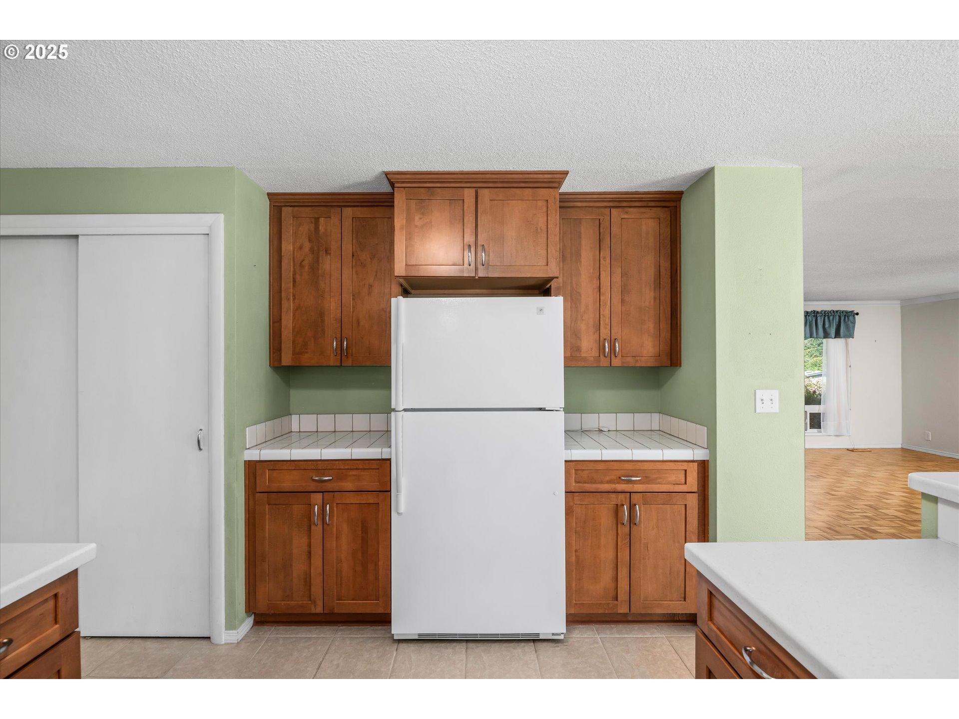 3985 Donald Street Eugene, OR 97405 - Photo 17 of 39 a kitchen with a refrigerator a stove and a microwave