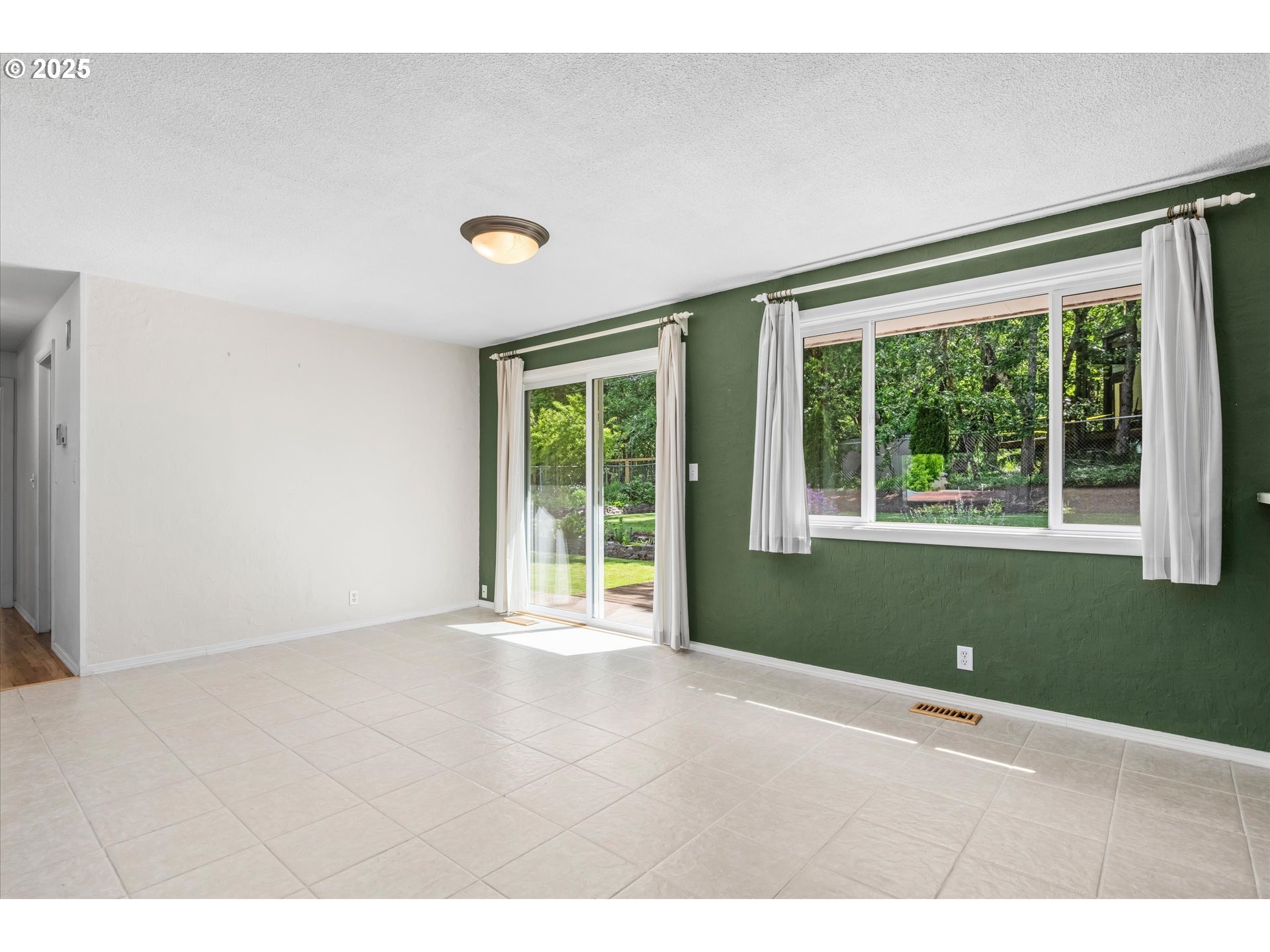 3985 Donald Street Eugene, OR 97405 - Photo 18 of 39 a view of an empty room with wooden floor and a window