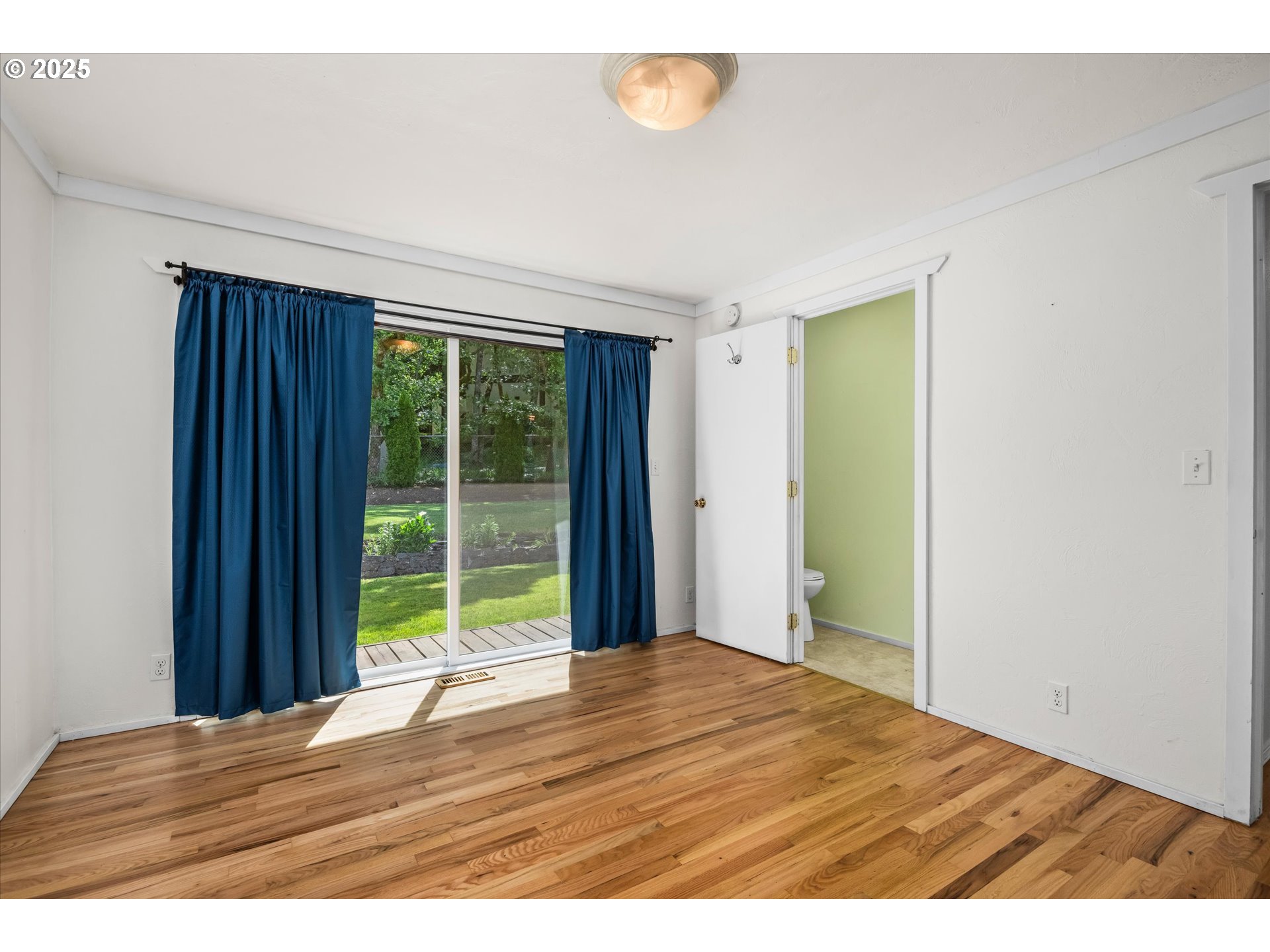 3985 Donald Street Eugene, OR 97405 - Photo 25 of 39 a view of an empty room with wooden floor and a window