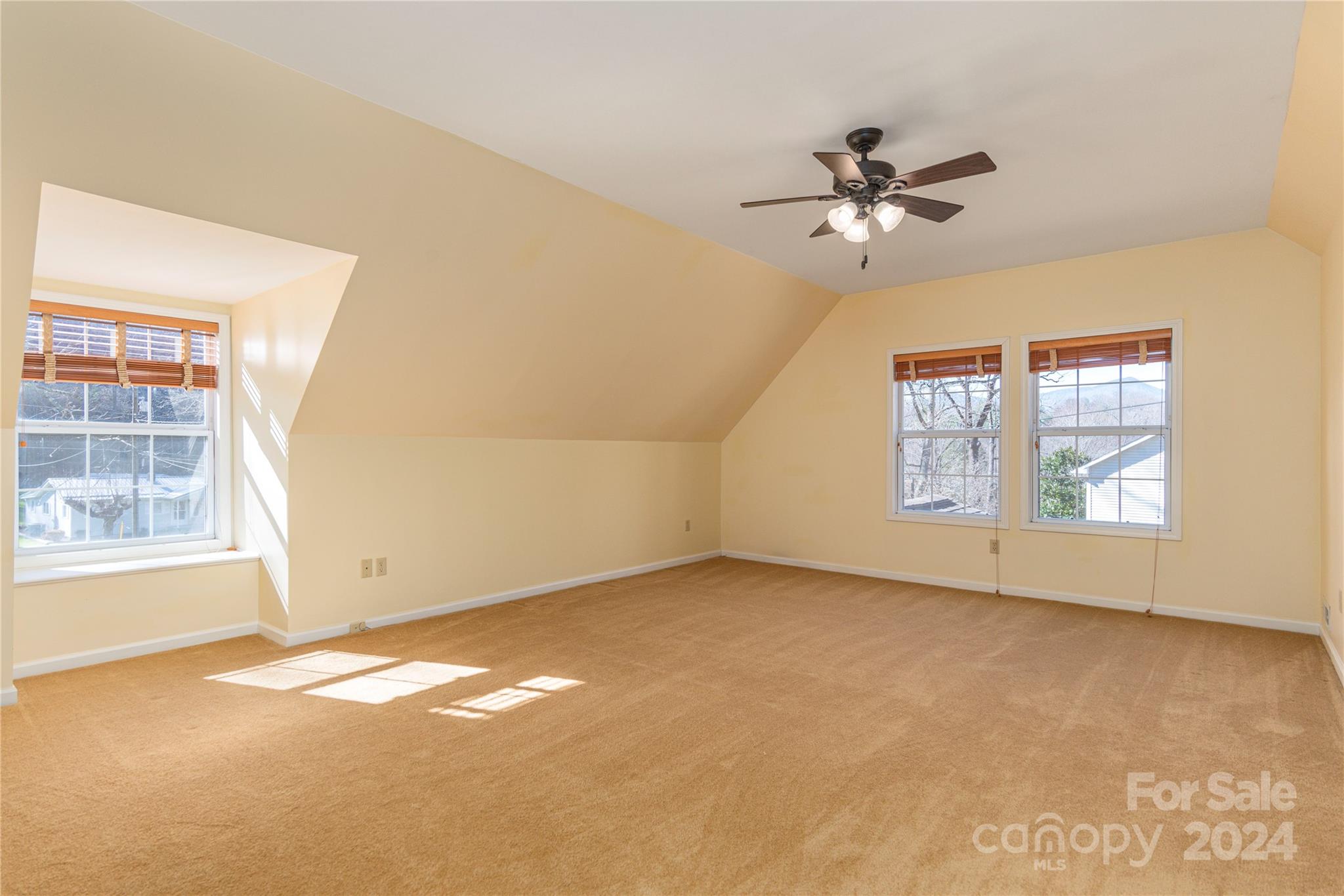 1201 Camp Branch Road Waynesville, NC 28786 - Photo 21 of 26 an empty room with windows and fan